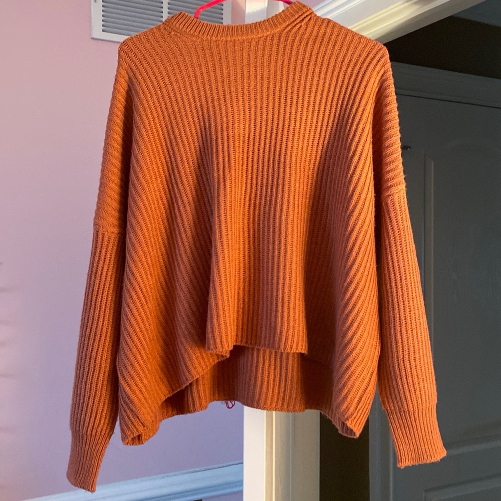 Poof apparel sweater! Sorta of a burgundy/maroon color!